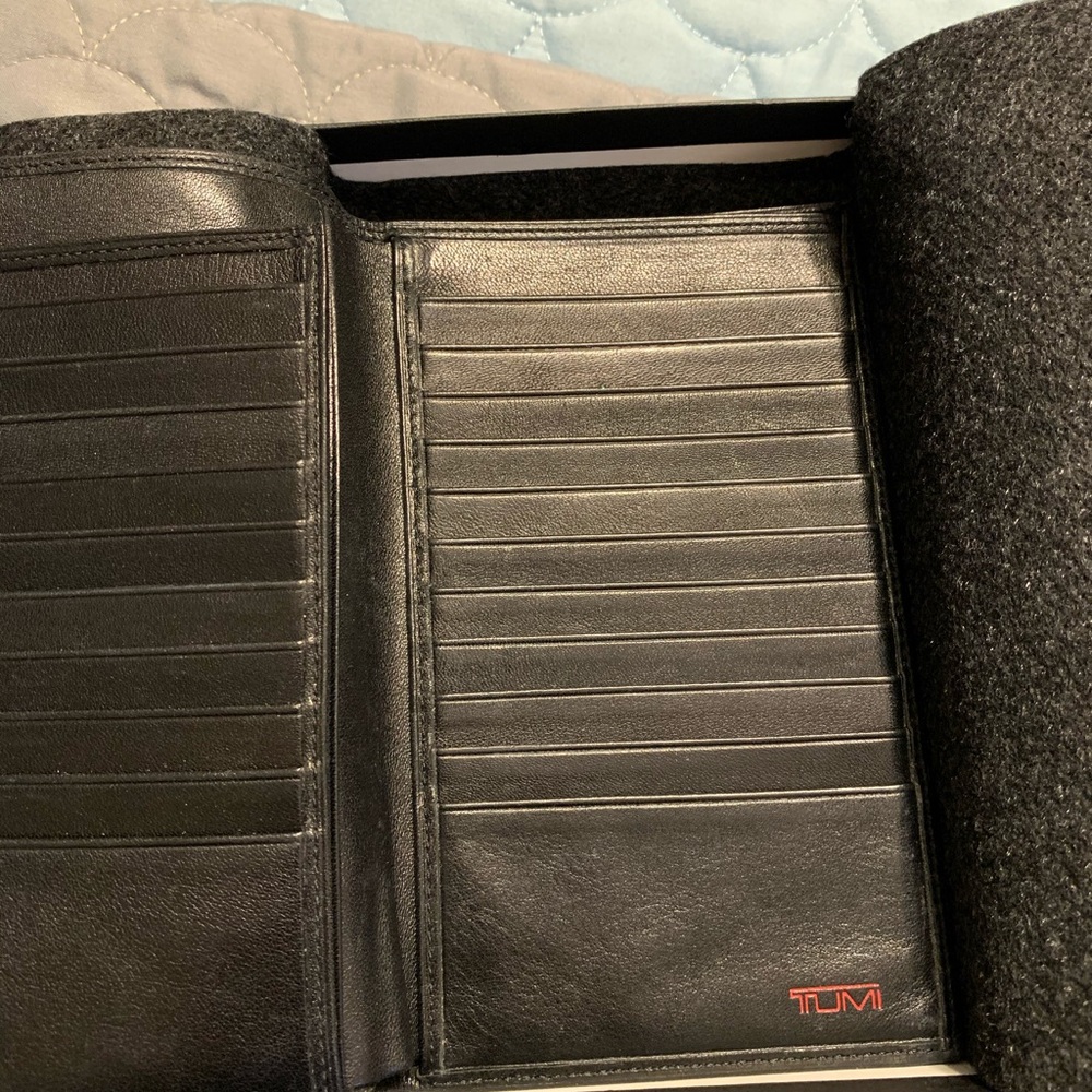 Wallet made by TUMI. Genuine leather.